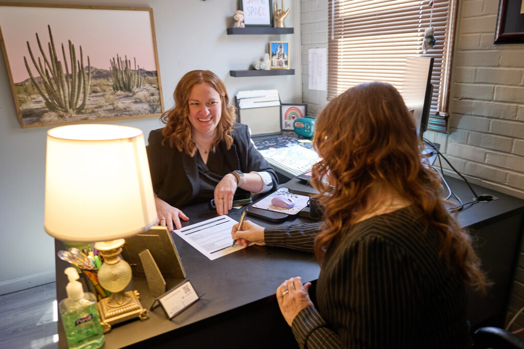 Health Plus Indiana counselor walking a colleague through a confidential intake form.